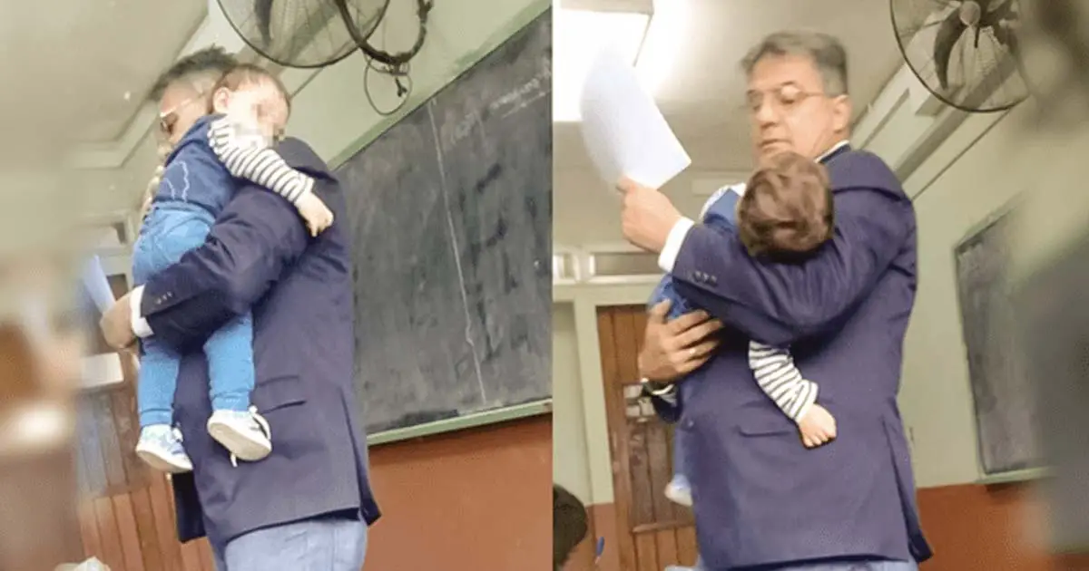 un-prof-porte-le-bebe-dune-eleve-pour-quelle-puisse-suivre-le-cours-min